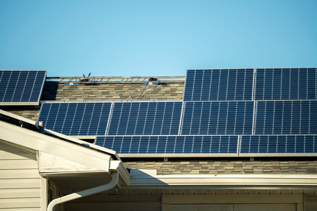 Solar panels on asphalt shingle roof
