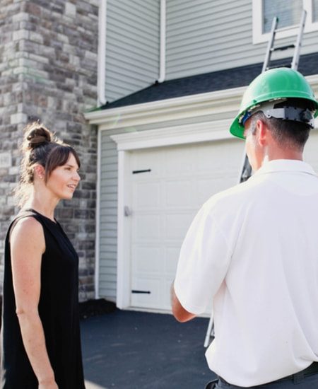 A Roof Maxx dealer gets ready to inspect a customer's roof.